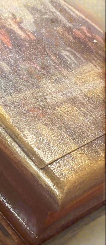 Close-up of one corner showing the reflection and rustic textured detail of the top of the box.