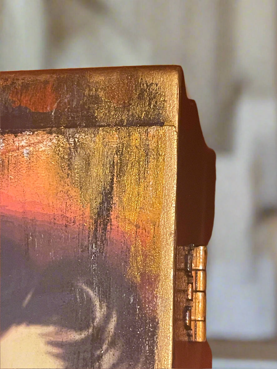 Close-up of Gold leaf and textured surface with a blurred background