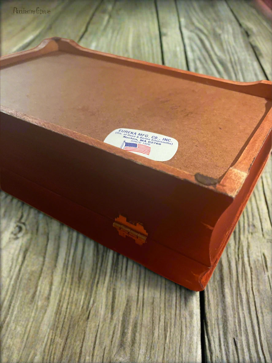 Close-up of the bottom of jewelry box showing the original manufacturer label.
