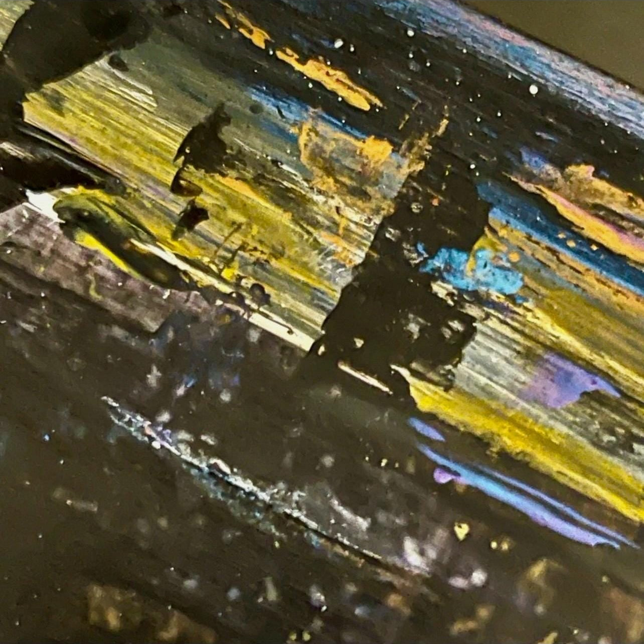 Close-up of a textured , hand painted accents on surface of panel. Zoomed-in details.