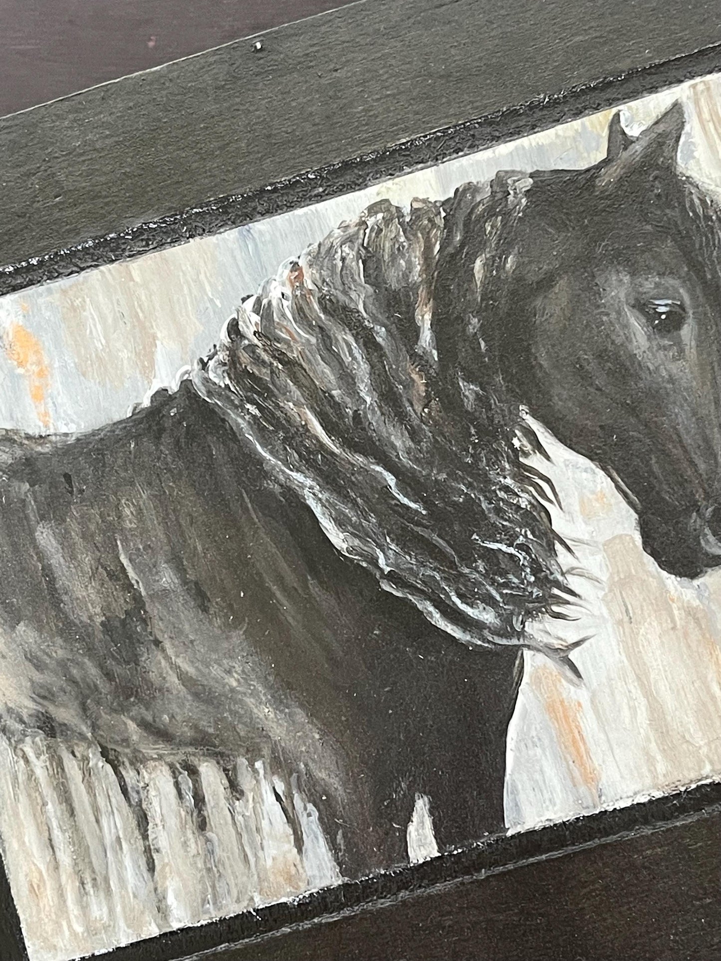 Close-up of a horse painting on a decorative upcycled box.